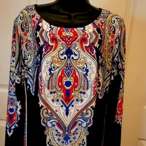 Cute fun dress. Lots of details in the design.